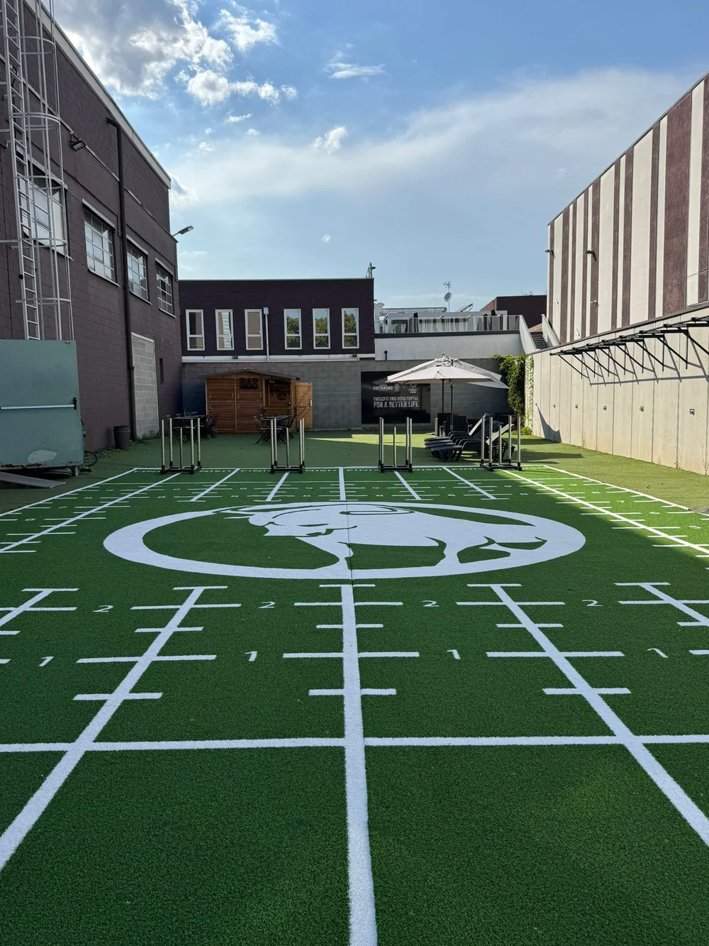 Outdoor custom sled track turf with multiple marked training lanes