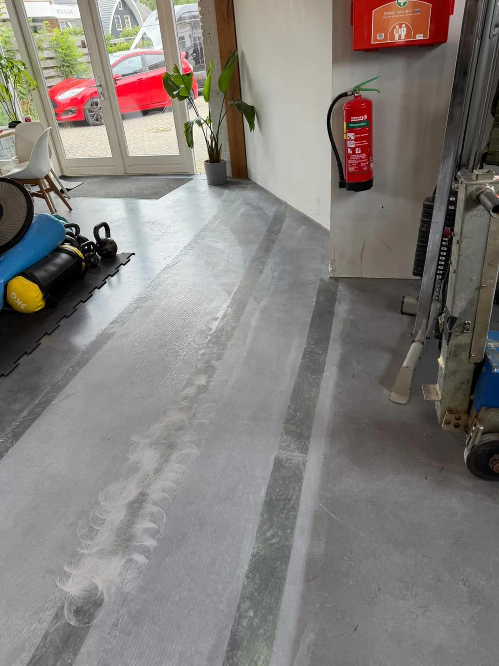 Prepared gym floor before the customer installed the 30m green training turf in the Netherlands