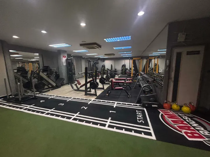Custom branded turf lane inside the Thailand customer gym