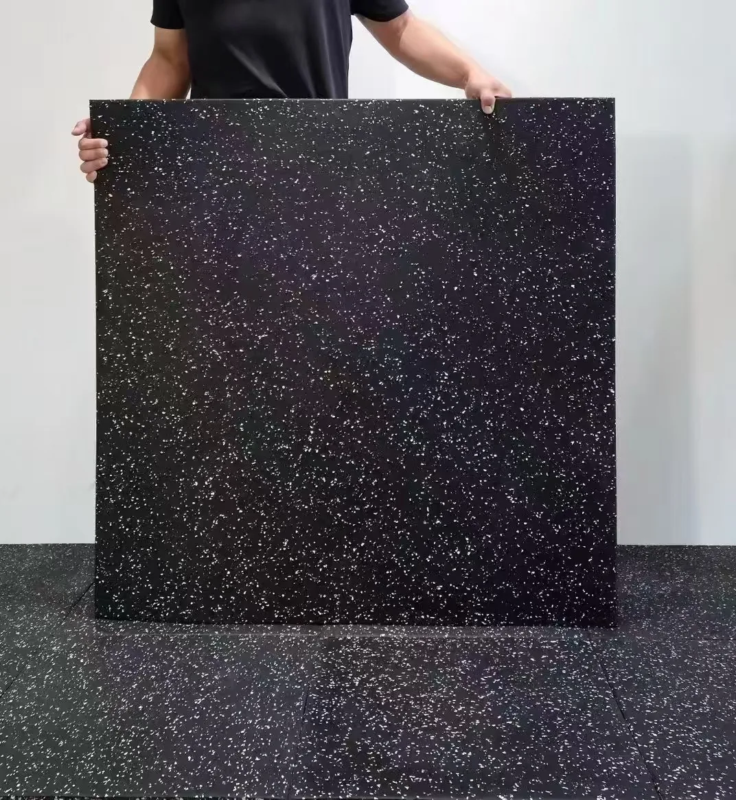 Large square composite rubber gym tile shown at human scale