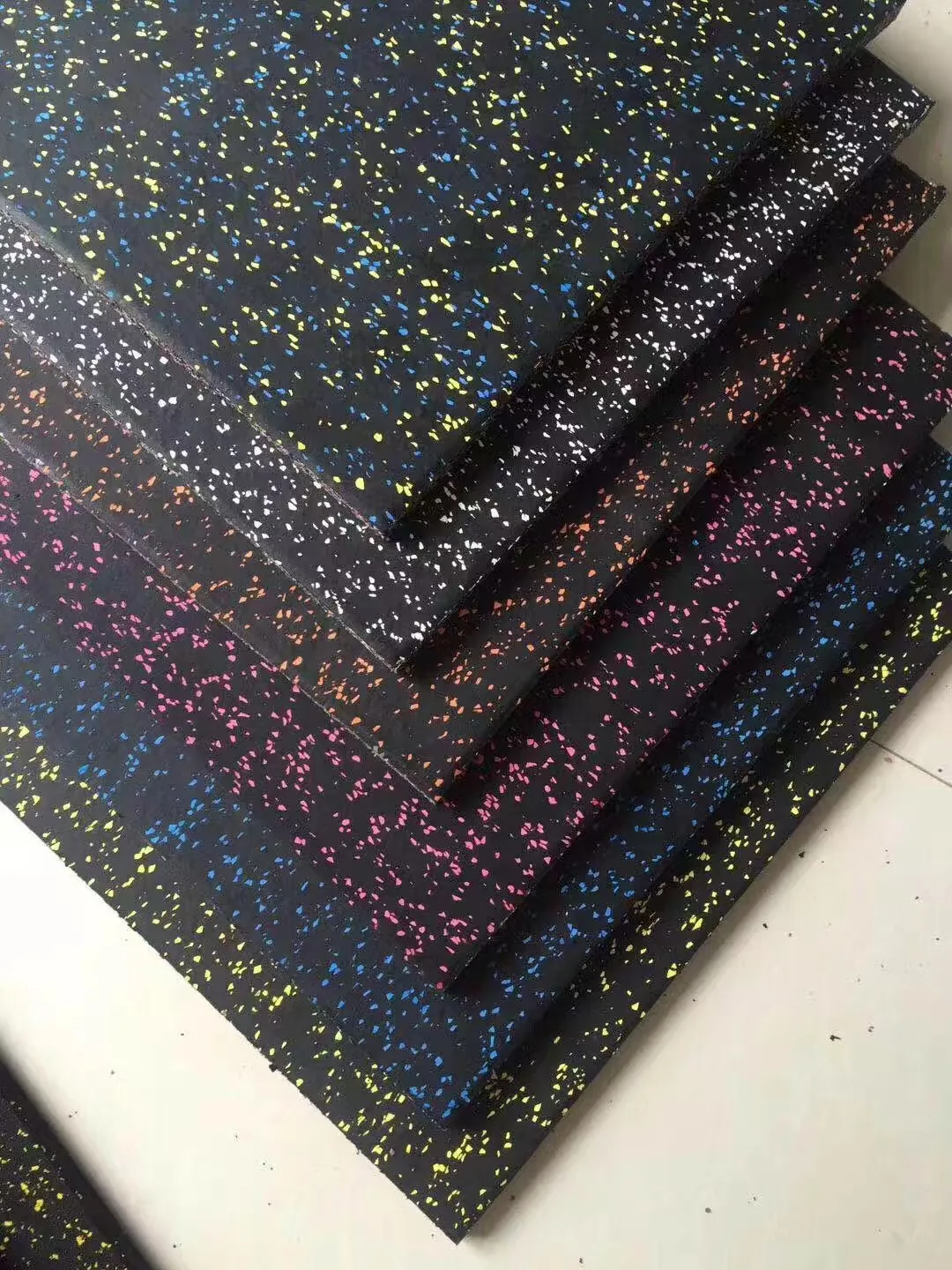Rubber gym tile samples with solid and EPDM speckled color directions
