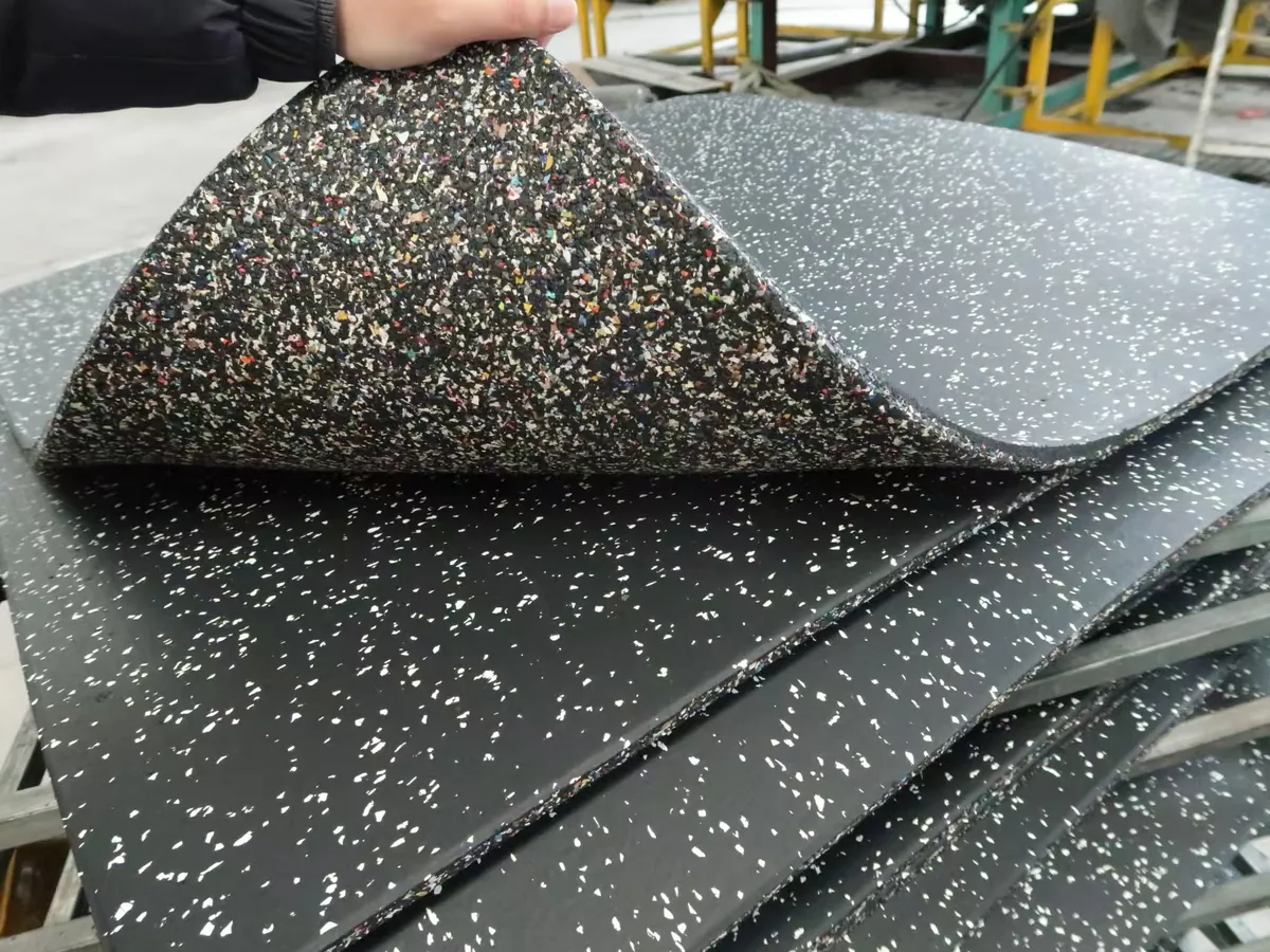 Composite rubber gym tile showing 1 mm EPDM surface layer and rubber base