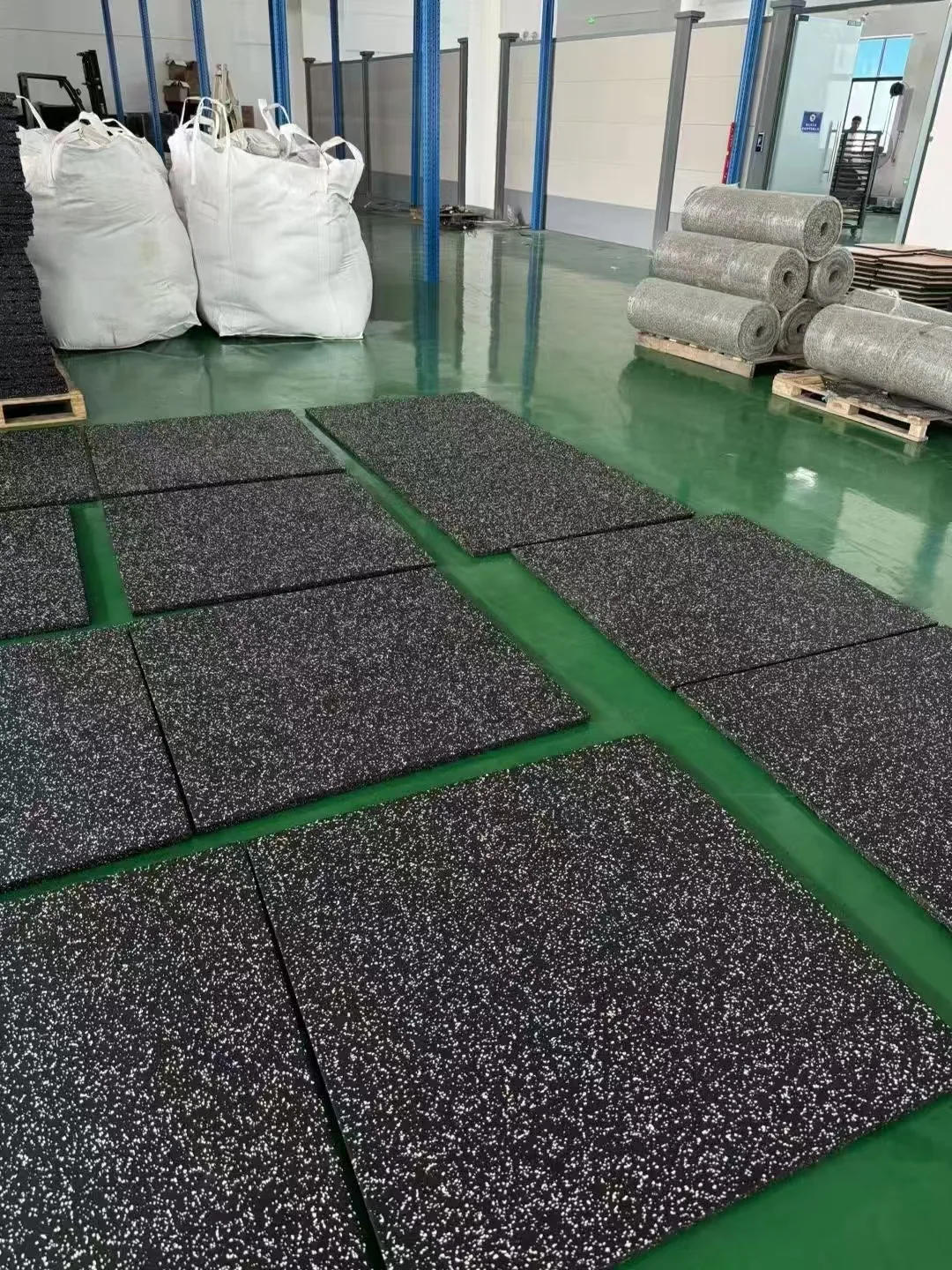 Rubber gym tiles arranged during factory production and inspection